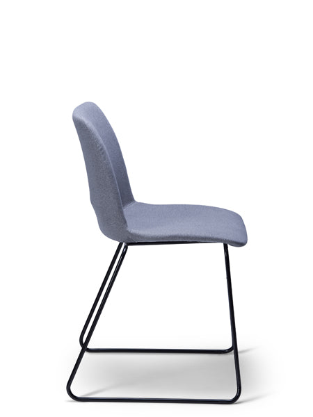 Breo blue grey upholstered chair with a black sled base, side view