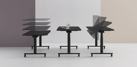 Three black Jojo Electric Folding Tables side by side with castor feet, showing height adjustment, standard desk setup, and foldable option
