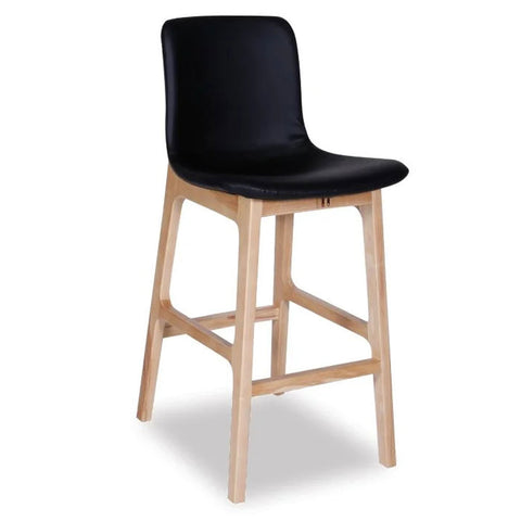 A black upholstered Ara stool with a contoured seat and wooden legs