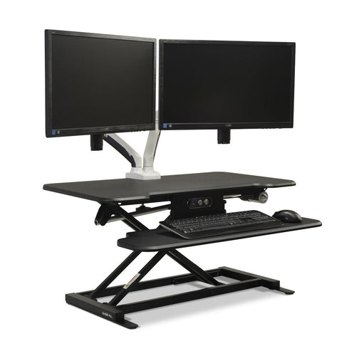 Vertilift Pro desk riser in black with keyboard platform and dual monitors at standing height