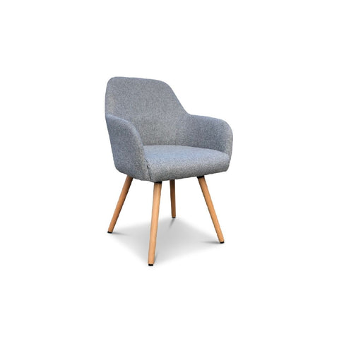 A grey upholstered tub chair with beechwood legs