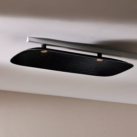 Fuji Juni black long rectangular acoustic tile with art deco curve and embossed linework, fixed to a ceiling.
