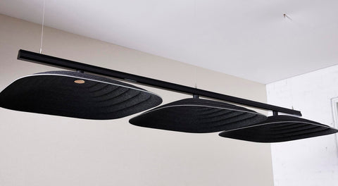 Fuji Ku large square black 3D acoustic tiles with a woven pattern, suspended from the ceiling