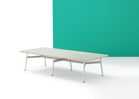 A long, rectangular Okidoki+ conference table with multiple leg options, featuring a light tabletop and light-colored frame