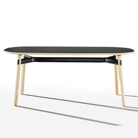 Okidoki rounded rectangular table with black top, black frame, and ash timber legs