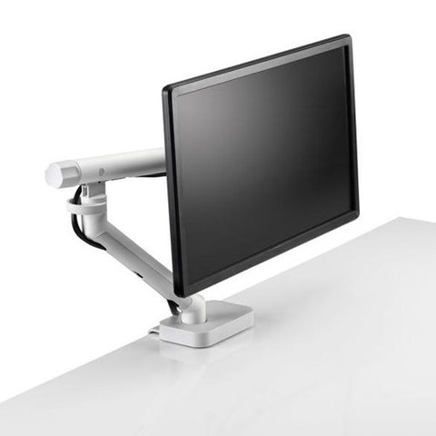 Flo single monitor arm mounted on a desk with a monitor attached to it.