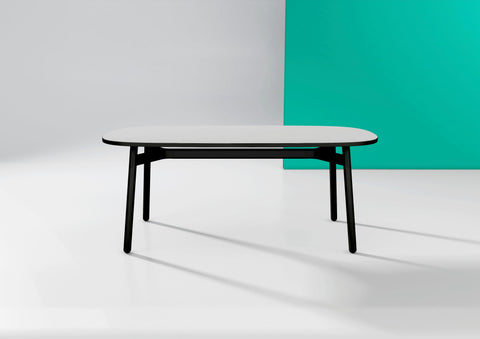 Okidoki rounded rectangular table with white top, black frame, and black timber legs