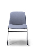 Breo blue grey upholstered chair with a black sled base, front view
