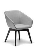 Delphi upholstered armchair with black timber legs.