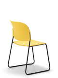 LUMIA PP multipurpose chair in yellow with plastic seat and sled base frame, back view
