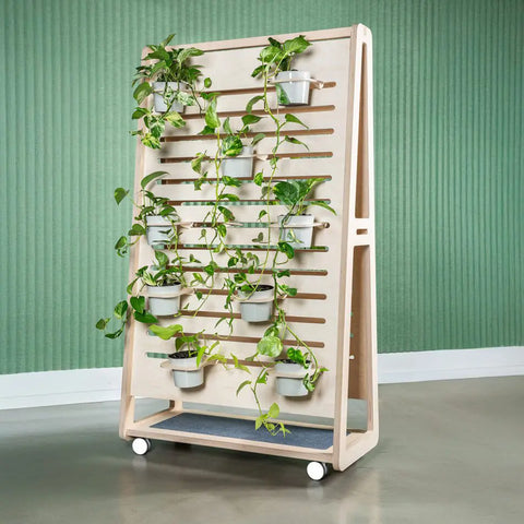 Etch unit configured as a planter in birch plywood, bringing biophilic design and greenery into the workplace