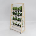 Etch planter in birch plywood holding rows of potted plants, adding greenery and natural office design