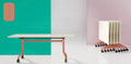 I.AM folding tables with white tops and pink frames, shown side by side in upright and folded stackable positions
