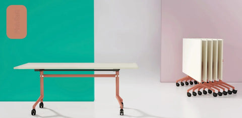 I.AM folding tables with white tops and pink frames, shown side by side in upright and folded stackable positions
