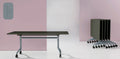 I.AM folding tables with olive tops and grey frames, shown side by side in upright and folded stackable positions
