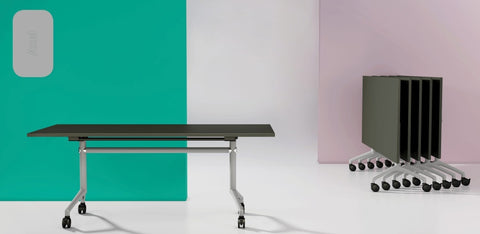 I.AM folding tables with olive tops and grey frames, shown side by side in upright and folded stackable positions
