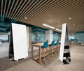 Jart mobile whiteboard with double-sided magnetic surface, concealed storage shelves and lockable castors, shown in a modern office setup
