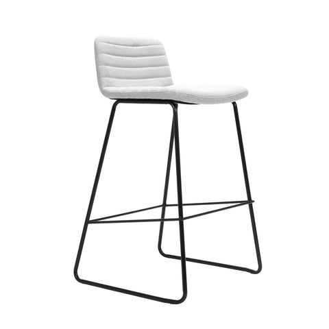 Pixel Bar Stool in light grey fabric upholstery with ribbed stitching detail and sturdy black sled base with foot rail