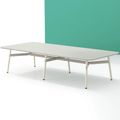 A long, rectangular Okidoki+ conference table with multiple leg options, featuring a light tabletop and light-colored frame