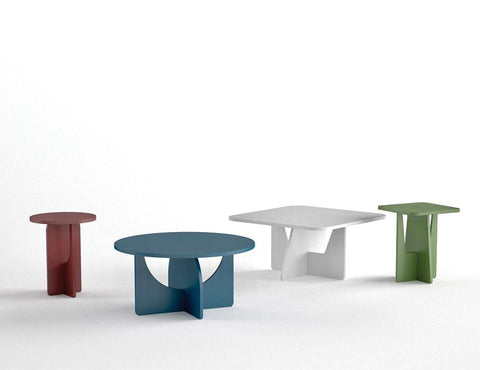 Set of four modern square side tables in red, blue, white, and green finishes, featuring minimalist MDF construction and geometric design.

