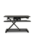 Vertilift Pro desk riser in black with keyboard platform extended to standing height