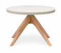 A round white coffee table with European ash timber legs