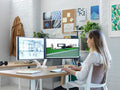 User working on two monitors mounted on a Flo dual monitor arm