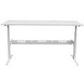 A white height-adjustable desk with visible desk legs and an under desk cable management system.