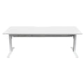 White height-adjustable desk with visible legs in low height position, sit-to-stand workstation for offices