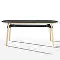 Okidoki rounded rectangular table with black top, black frame, and ash timber legs
