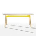 Okidoki rounded rectangular table with white top, yellow frame, and ash timber legs
