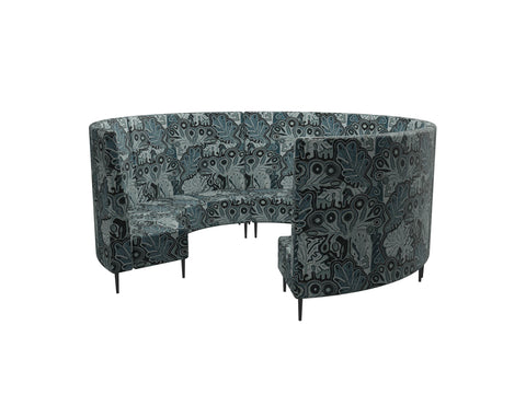 Round modular lounge in Blue Indigenous Fabric made up of connected chair and bench units, with a high back